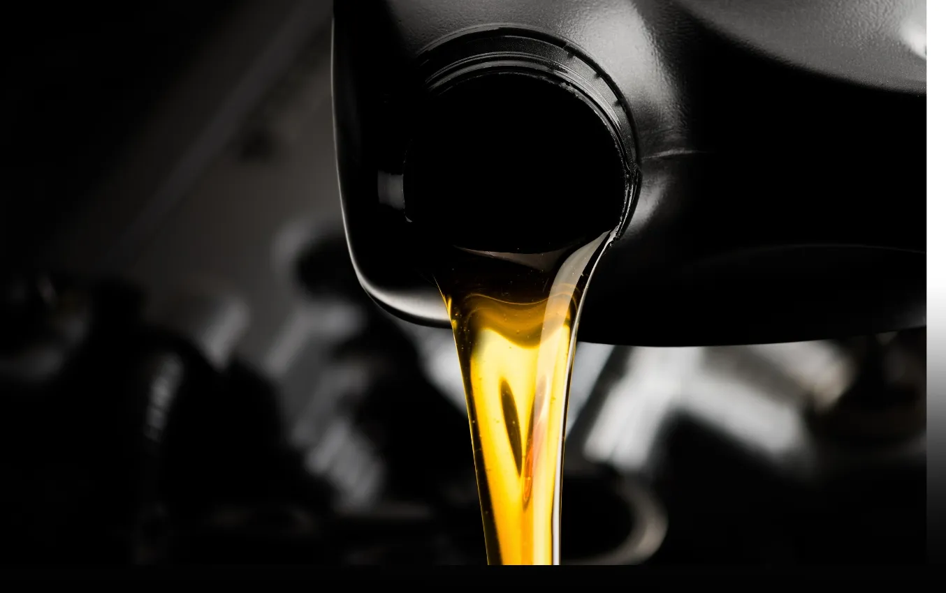 Golden engine oil pouring from a container.
